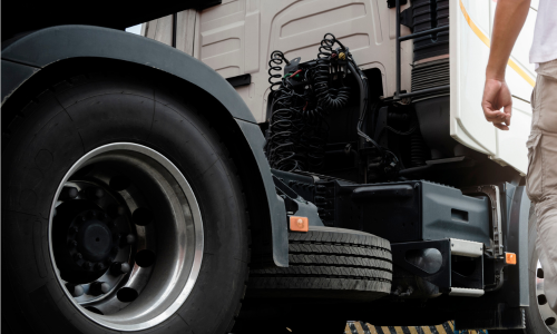 Man walking towards a tractor trailer