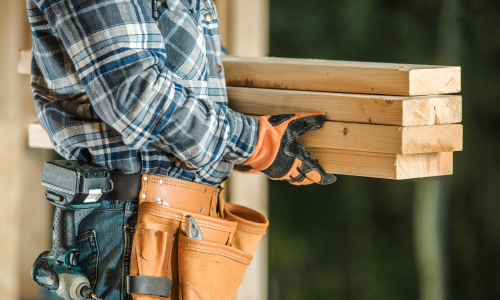 Man carrying lumber